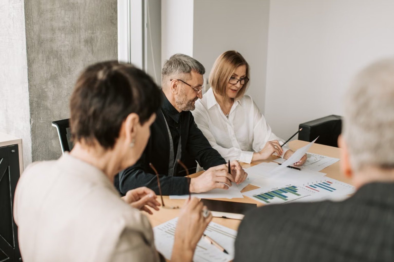A finance team going through monthly management accounts
